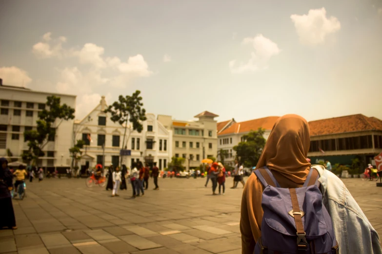 the backpacker is wearing a hooded cloth