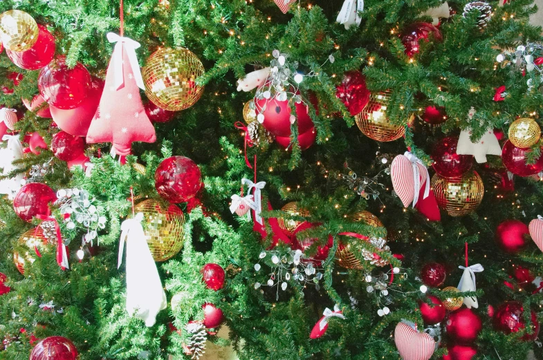 an assortment of ornaments on a tree