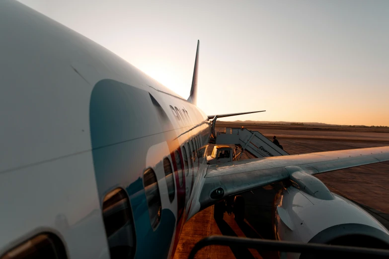 a passenger jet sitting on top of an airport tarmac