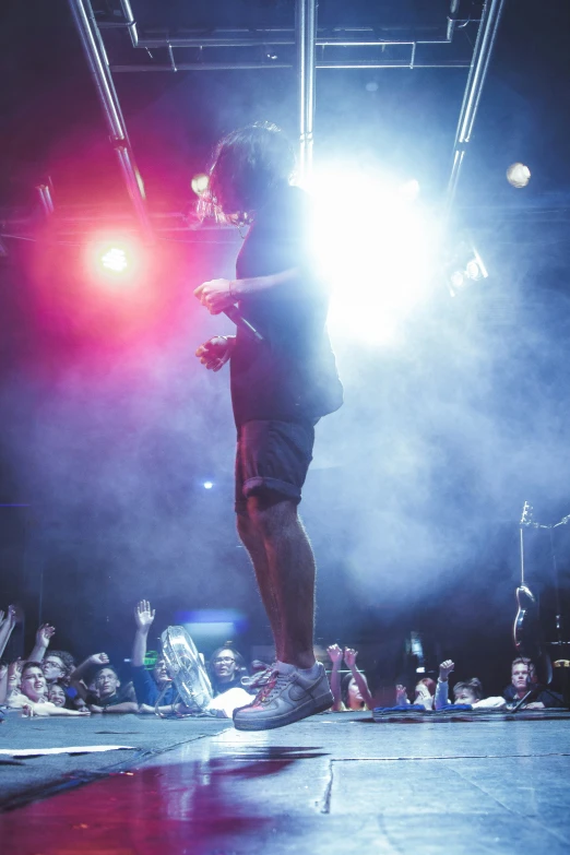 a person standing on a stage in front of people