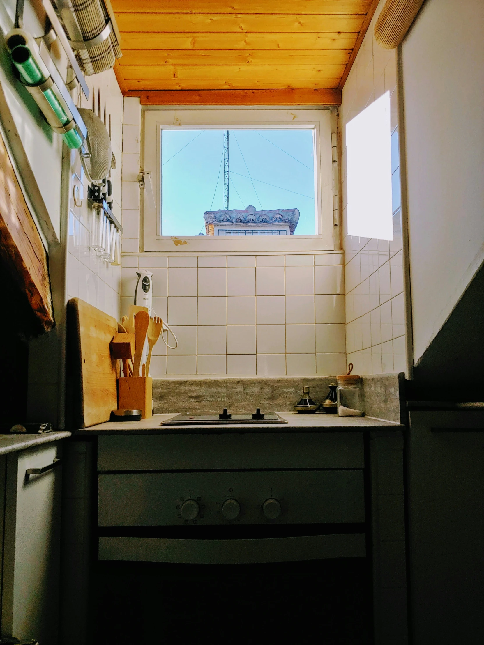 a stove with two different burners and a window