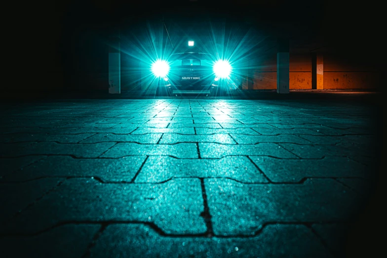 a car driving down a road with two lights on