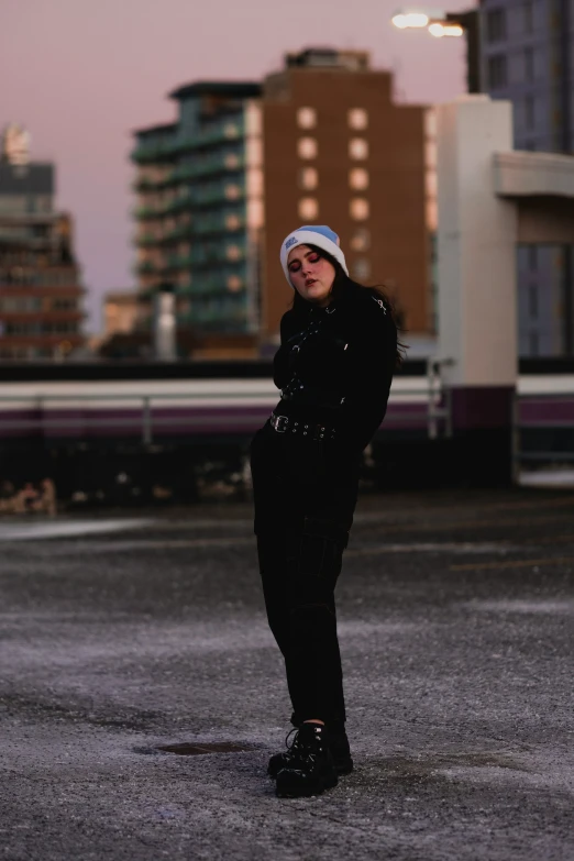 a woman poses in front of the skyline