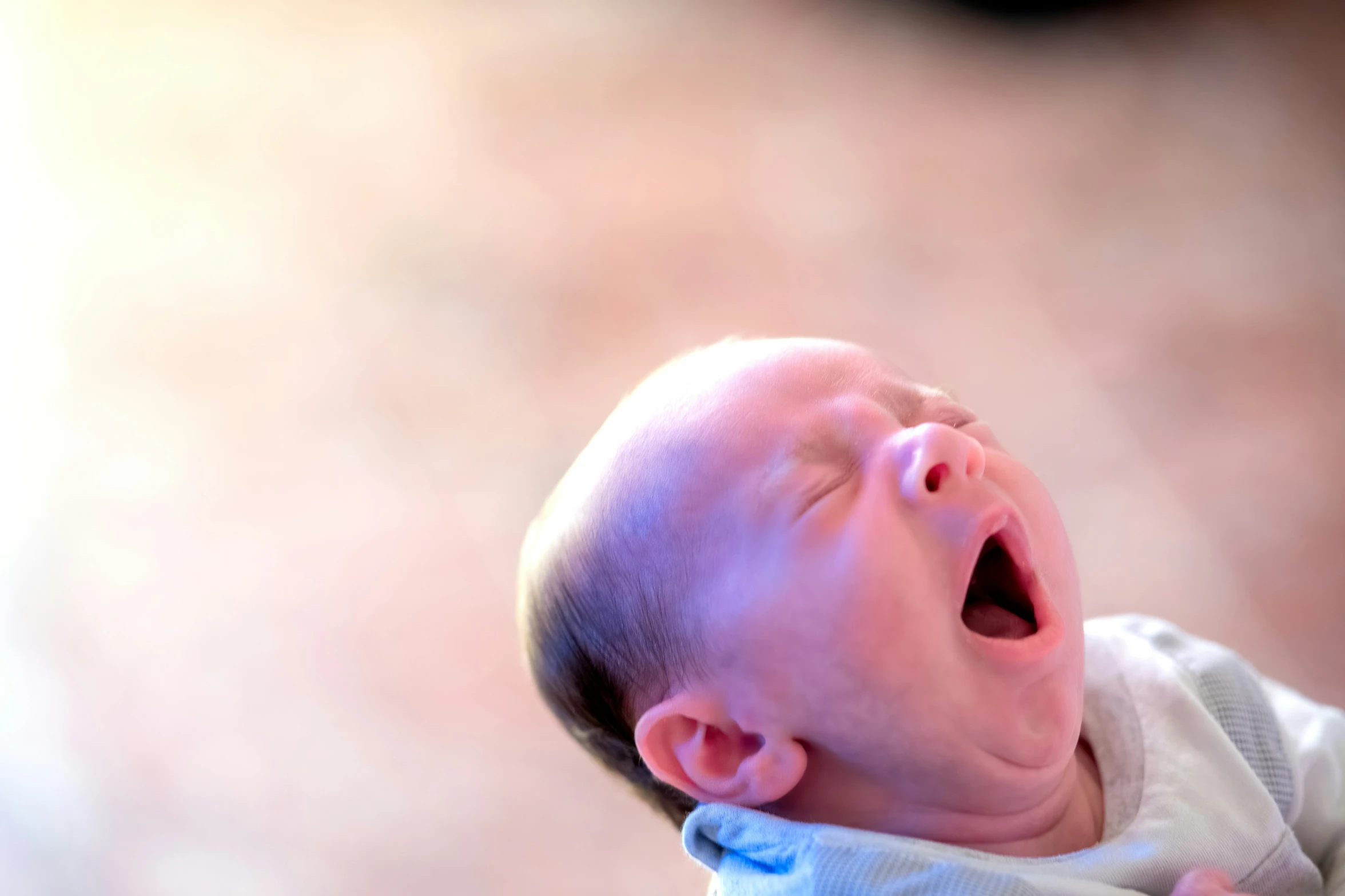 a close up view of a crying baby