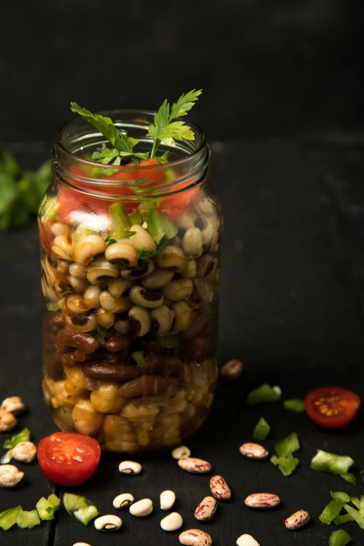 a jar filled with different types of beans