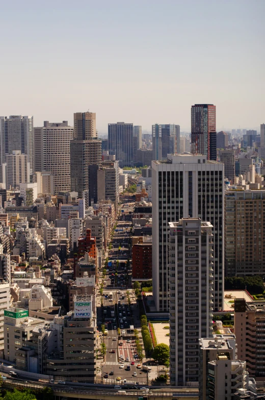 a cityscape with skyscrs and roads in the foreground