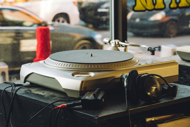 a golden turntable that is on top of some tables