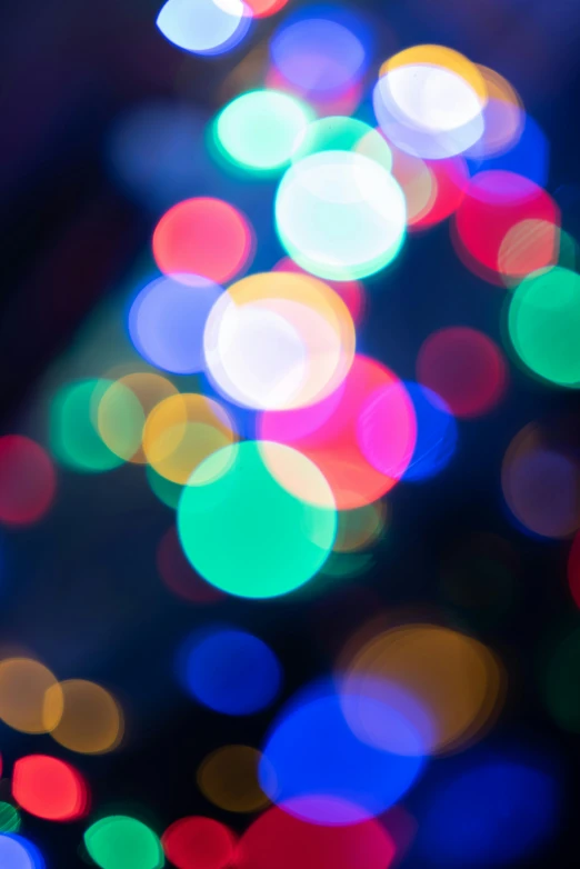 many colorful lights on the dark night with some blurred one