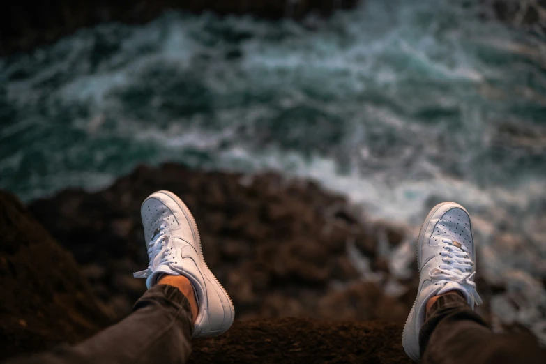 a person with a pair of feet in the water