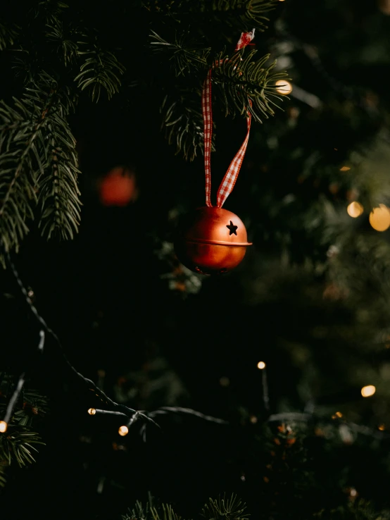 a tree is decorated with red and white ornaments