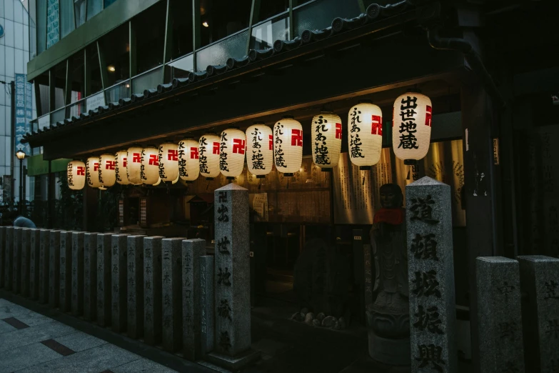 oriental lanterns are hung up outside a store