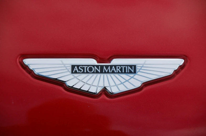 the emblem on a red, modernly designed vehicle