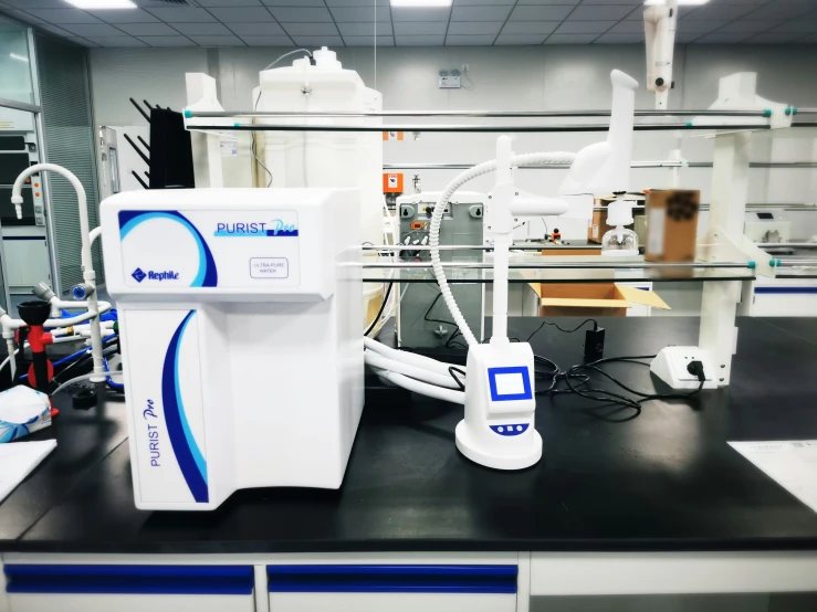 a machine sits on a table inside a lab