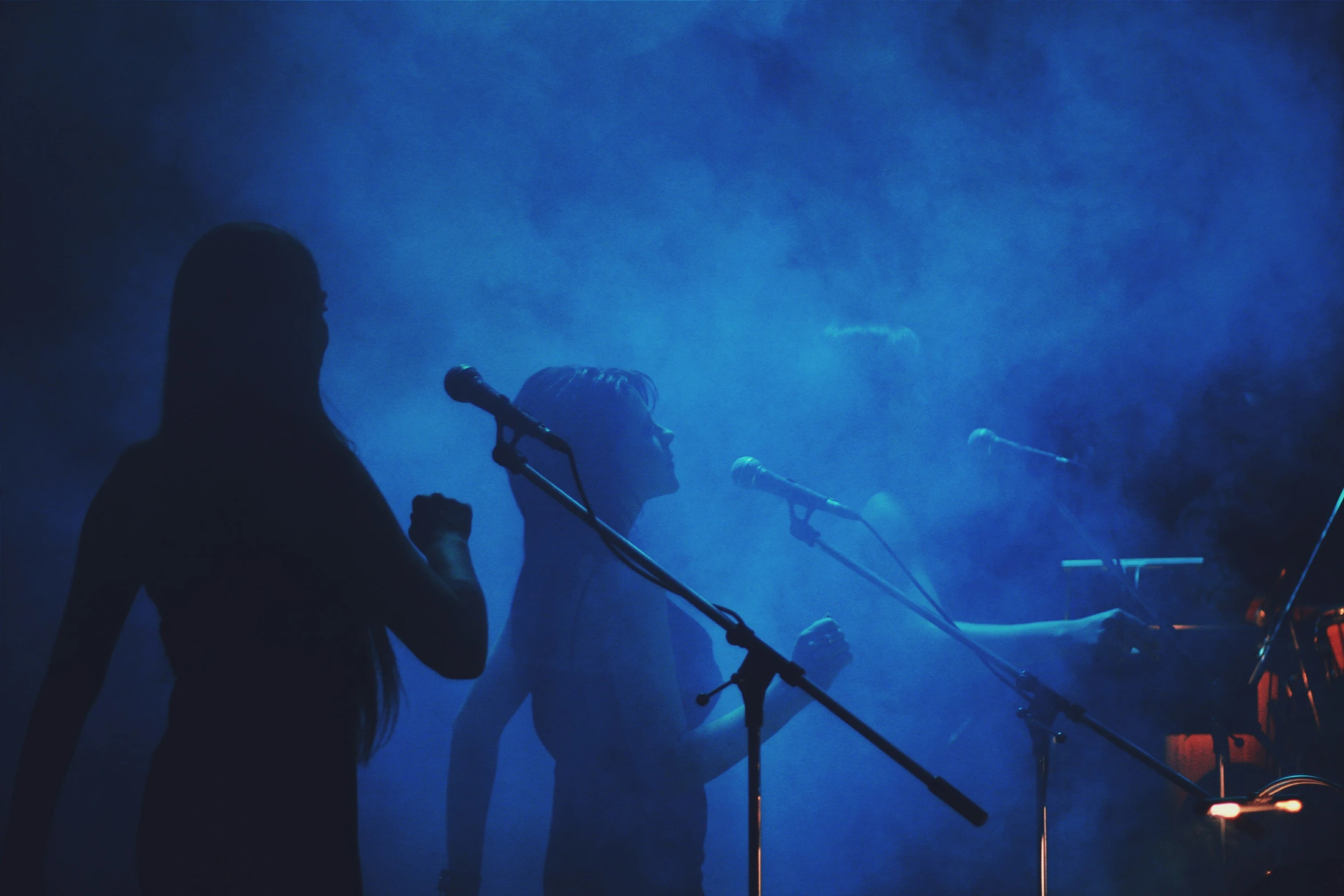 some people are in silhouette playing music together