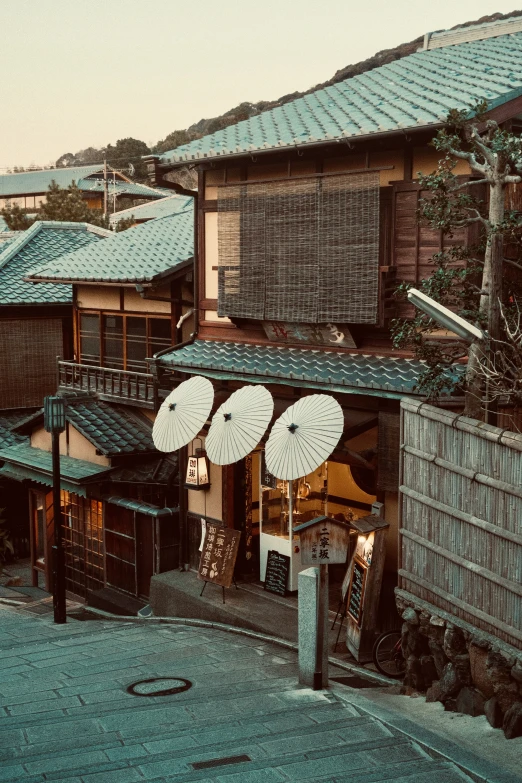 some houses that are connected by umbrellas and some kind of soing