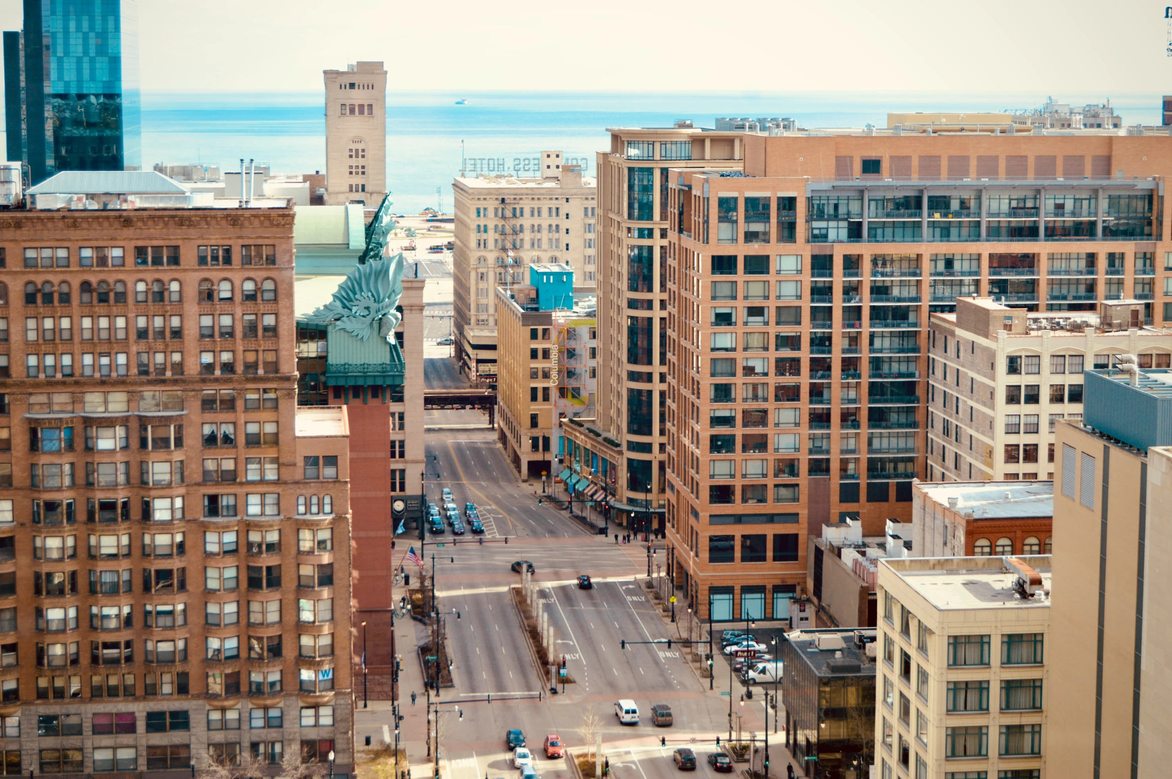 an aerial view of a city street on a sunny day