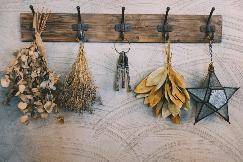 some hanging pieces of metal are shown on the wall