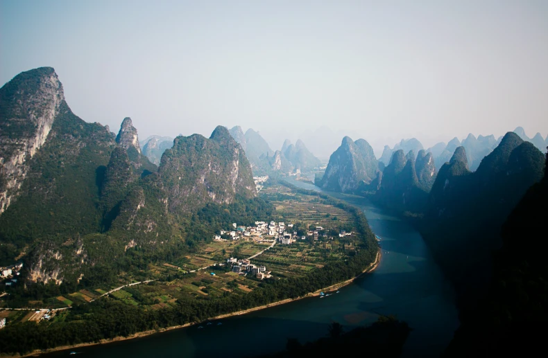 there is a scenic view of mountains and river