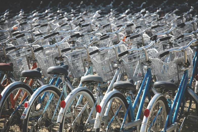 a lot of bikes that are all blue and white