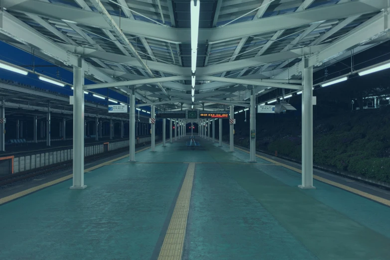 there are several poles attached to the platforms at the train station