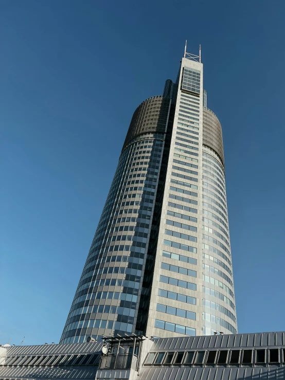 a tall building with a blue sky behind it