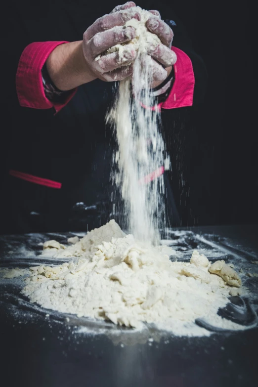 a person is making food out of flour