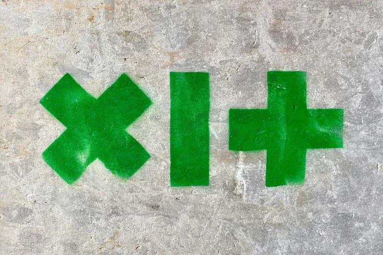 the green letters are painted on the cement