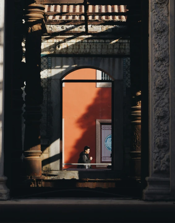 an arch over looking the ground near an entrance