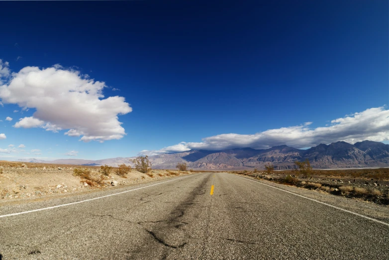 a view of an empty road with a sky background