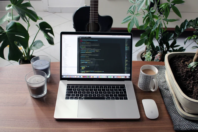 a laptop computer is sitting on top of a desk