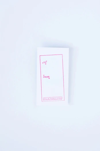a single pink and white piece of paper with a tiny note attached