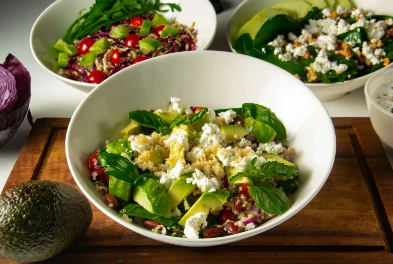 a table topped with bowls filled with salad