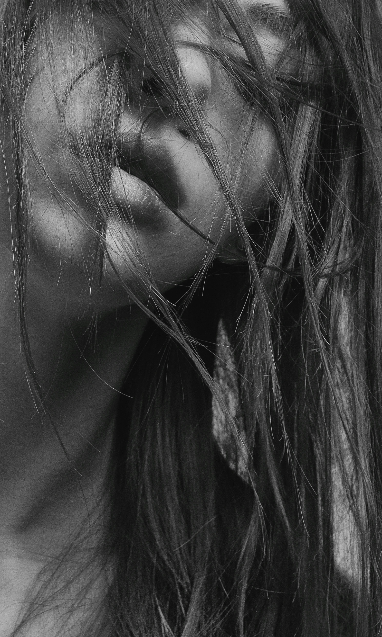 a close up image of a womans face and a lot of hair