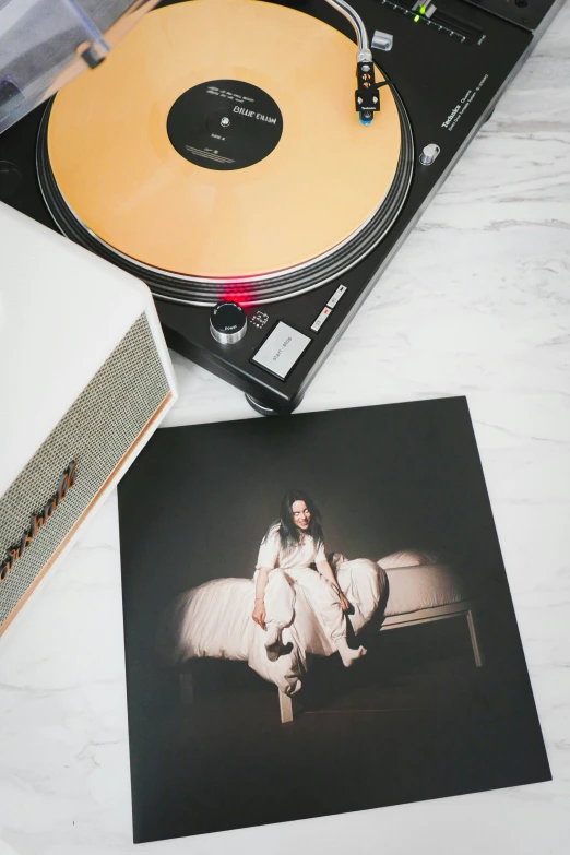 some record players on top of a white table