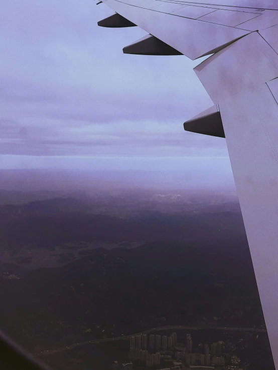 some very pretty airplane wings with some buildings