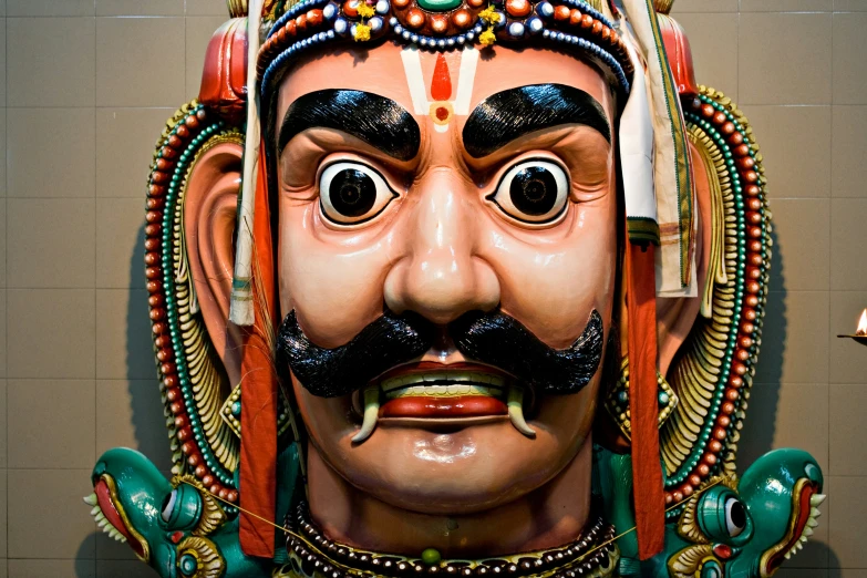 a strange looking fake statue in an indian temple