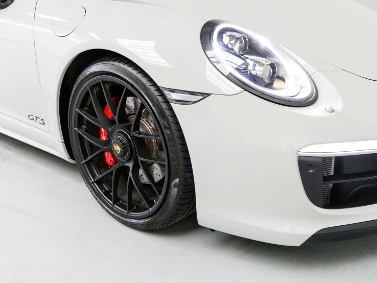 the front of a white porsche sports car