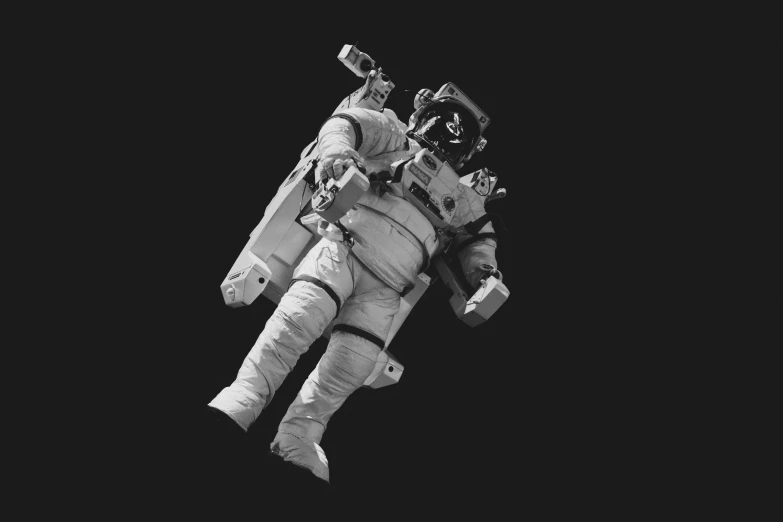 a man standing on the moon with one foot in the air