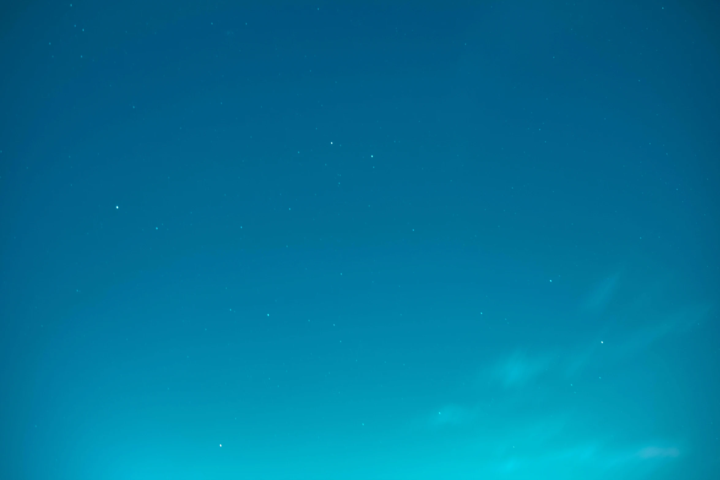 the view of an old farm with the moon and distant stars