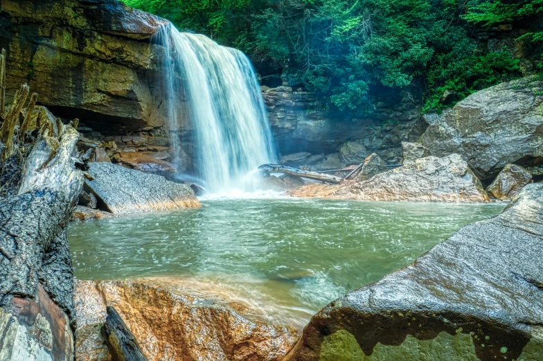 a large waterfall in the middle of rocks