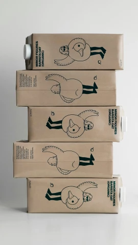 three boxes with drawings of cats and dogs are stacked on one another