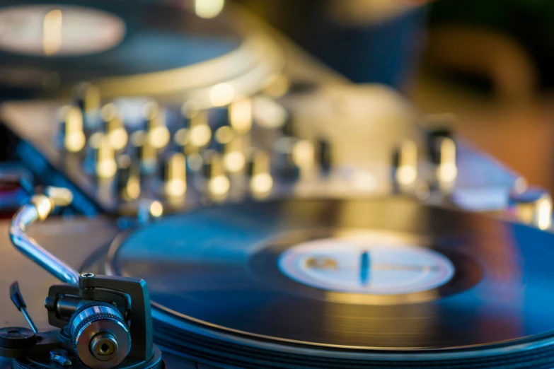 a dj turntable at a record player in a recording studio