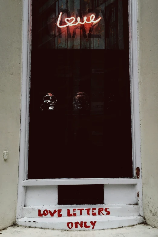 a store window with the word love written in front