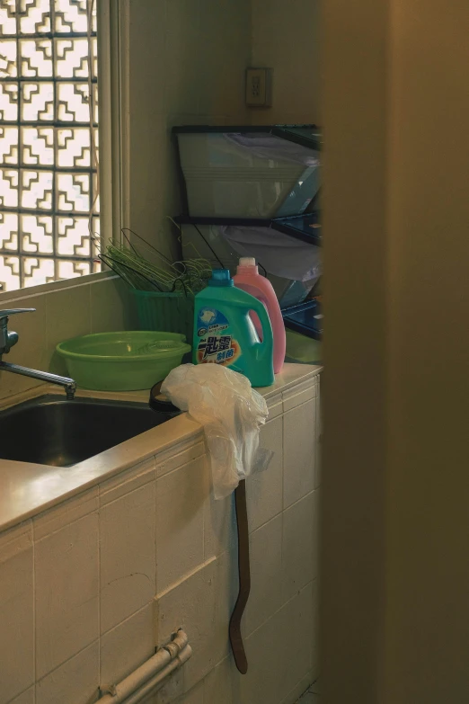 view of sink, tub and window with towels on a towel rack