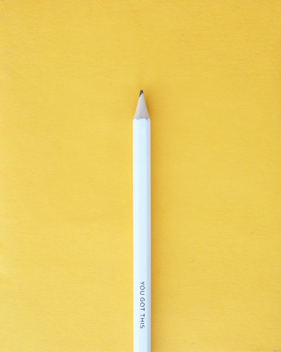 a pencil is shown lying on the surface