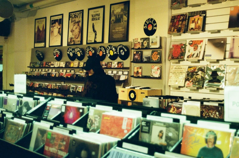 a shop filled with cds, cds cases and pictures