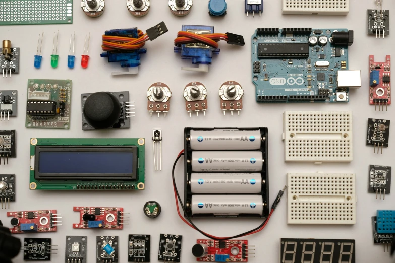 the electronics are scattered neatly around the electronic board