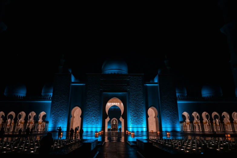 a very tall building with an illuminated entrance