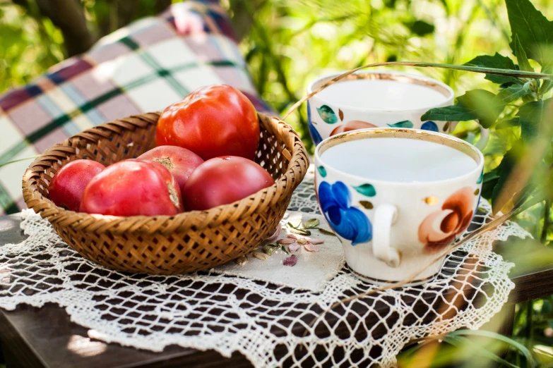 fresh fruits and cream, on the table in a basket, in the shade