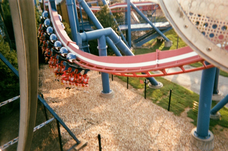 the aerial view of a roller coaster at a theme park